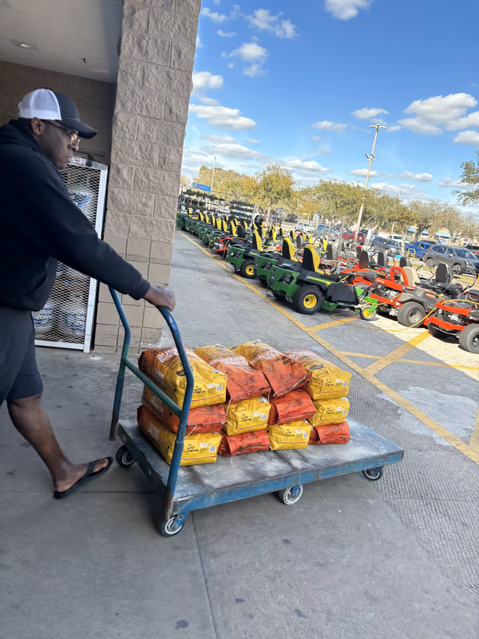 JP picking up Good Charcoal briquettes from Lowe's
