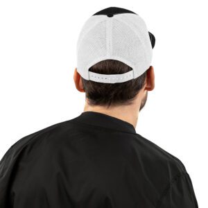 Back view of Black Trucker Cap with White Mesh and embroidered Barbeqquuuuueee logo on male model