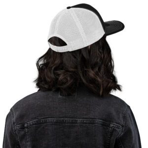 Back view of Black Trucker Cap with White Mesh and embroidered Barbeqquuuuueee logo on female model