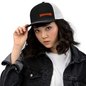 Black Trucker Cap with White Mesh and embroidered Barbeqquuuuueee logo on female model