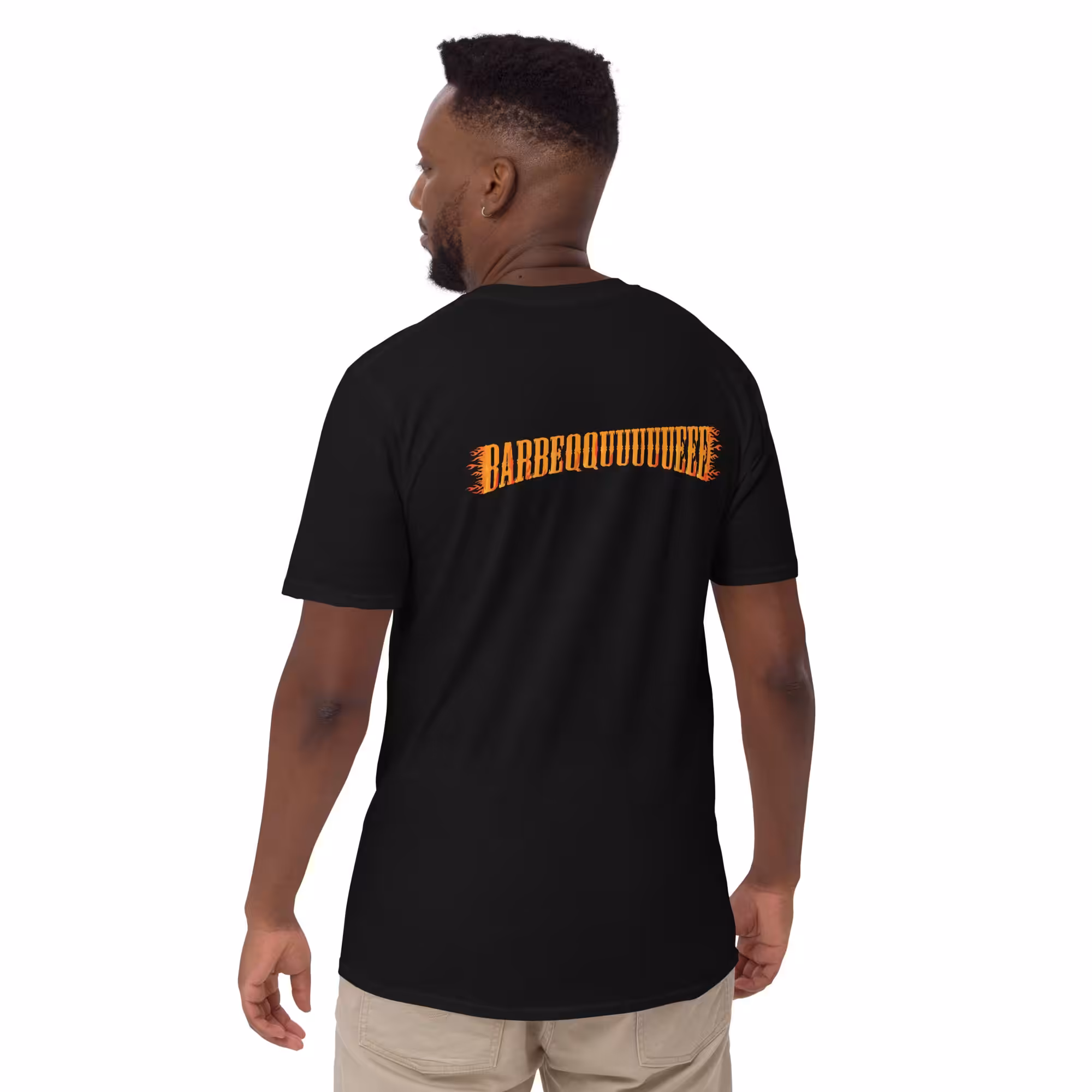 Male model wearing Gildan 64000 Unisex Softstyle T-Shirt with Bourbon & Blues BBQ logo on the front and displaying Barbeqquuuuueee graphic on the back